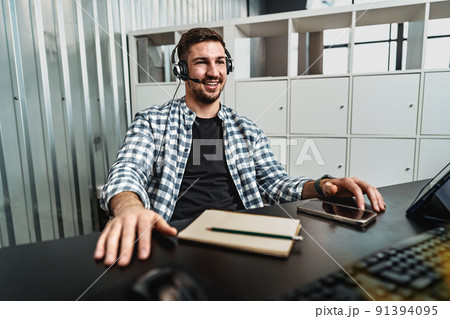 Customer service support operator man with headphones and microphone talking to client in call center Customer service support operator man with headphones and microphone talking to client in call center 91394095
