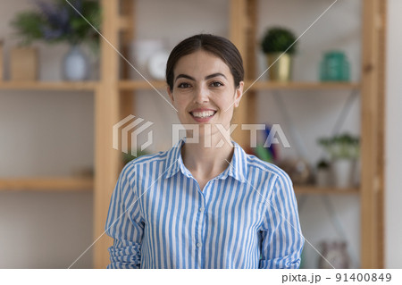 Attractive businesslady pose at workplace smile look at camera 91400849