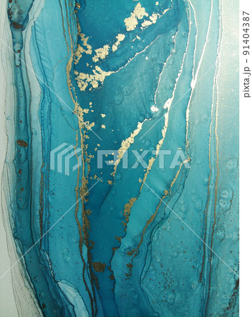 Luxury abstract fluid art painting in alcohol ink technique, mixture of blue, and gold paints. Imitation of marble stone cut, glowing golden veins. Tender and dreamy design. Luxury abstract fluid art painting in alcohol ink technique, mixture of blue, and gold paints. Imitation of marble stone cut, glowing golden veins. Tender and dreamy design. 91404387