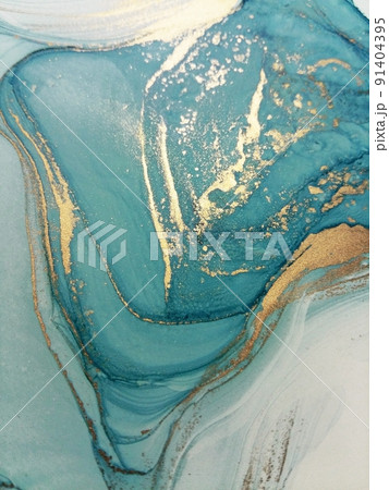 Luxury abstract fluid art painting in alcohol ink technique, mixture of blue, and gold paints. Imitation of marble stone cut, glowing golden veins. Tender and dreamy design. 91404395