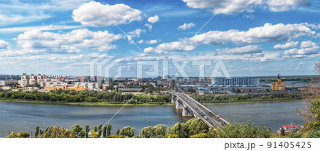 Panorama of Nizhny Novgorod, Russia. The Orthodox Cathedral of Alexander Nevsky, the soccer stadium and the bridge  91405425