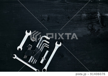 Tools for work or repair auto on black wooden background. Top view 91406076