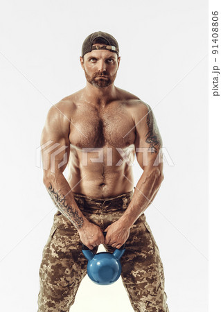 Muscular and fit young bodybuilder fitness male model posing over white background. Muscular and fit young bodybuilder fitness male model posing over white background. 91408806