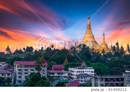 Shwedagon Pagoda attraction in Yagon City with blue sky background, Shwedagon Pagoda ancient architecture is beautiful pagoda in Southeast Asia, Yangon, Myanmar, Asian, Asia. Shwedagon Pagoda attraction in Yagon City with blue sky background, Shwedagon Pagoda ancient architecture is beautiful pagoda in Southeast Asia, Yangon, Myanmar, Asian, Asia. 91409212