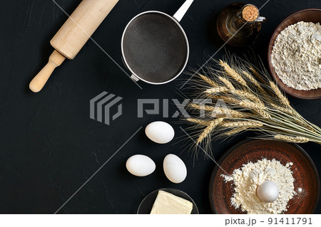 Pasta cooking ingredients on black kitchen table. Top view with space for your text Pasta cooking ingredients on black kitchen table. Top view with space for your text 91411791