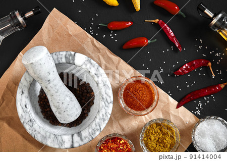Various spices and mortar on black background with copy space Various spices and mortar on black background with copy space 91414004