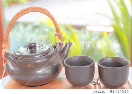 hand pour Chinese or Japanese traditional tea from clay pot hand pour Chinese or Japanese traditional tea from clay pot 91414516