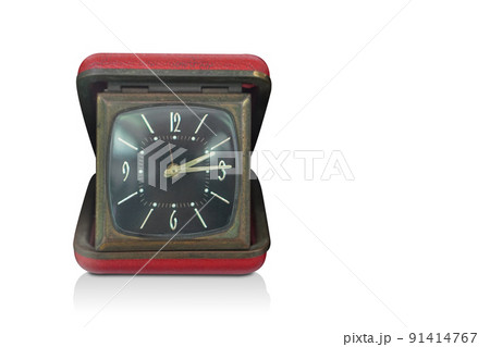 front view antique black and brass square alarm clock in a red rectangular leather box on white background, gift, old, ancient, modern, vintage, decor, copy space front view antique black and brass square alarm clock in a red rectangular leather box on white background, gift, old, ancient, modern, vintage, decor, copy space 91414767