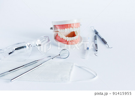 Doctor's dentistry tools for teeth dental care and treatment on white background. Doctor's dentistry tools for teeth dental care and treatment on white background. 91415955