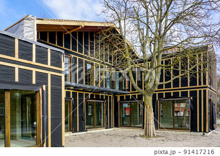 a simple modern two storey wooden private house under construction 91417216