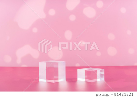 Acrylic blocks on pink background, pedestal cosmetic display glass podium platform for product presentation, geometric stand for cosmetics, mockup scene for jewellery Acrylic blocks on pink background, pedestal cosmetic display glass podium platform for product presentation, geometric stand for cosmetics, mockup scene for jewellery 91421521