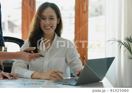 Business Finance audit tax Concept. Portrait of Young business women analytics about marketing plan of this years. 91425060