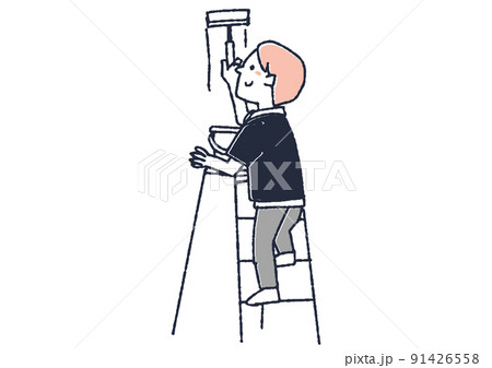壁にペンキを塗る男性　DIYで住居や家具をきれいに修繕する人々 91426558