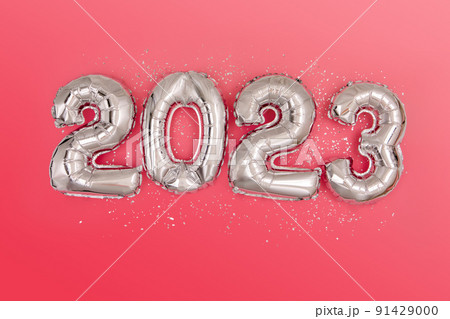 Silver foil balloons numeral 2023 and confetti Flat lay Silver foil balloons numeral 2023 and confetti Flat lay 91429000