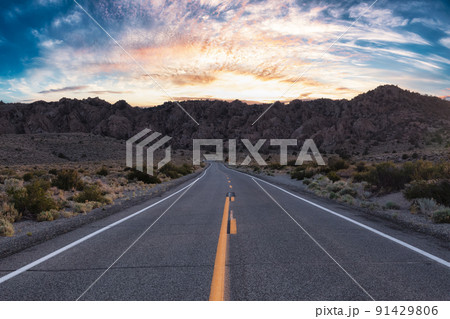 Scenic highway in the mountain landscape. Sunset Sky. Scenic highway in the mountain landscape. Sunset Sky. 91429806