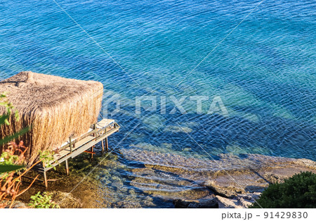 Beautiful background of blue sea. Rest and relaxation on the sea coast Beautiful background of blue sea. Rest and relaxation on the sea coast 91429830