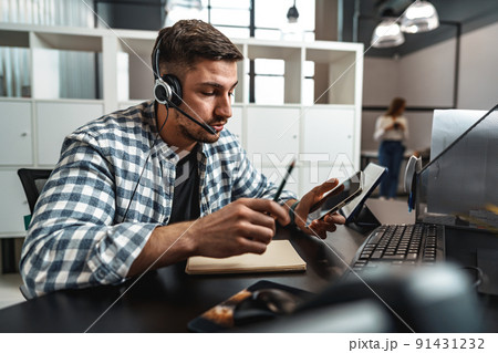 Customer service support operator man with headphones and microphone talking to client in call center Customer service support operator man with headphones and microphone talking to client in call center 91431232