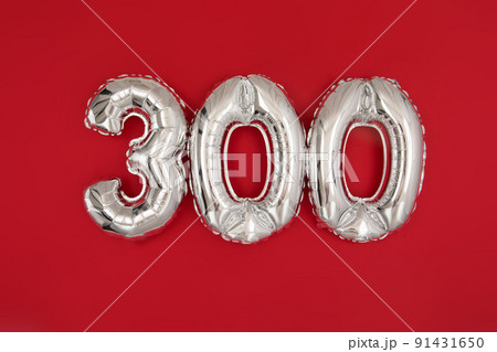 Silver balloon showing number 300 on red background 91431650