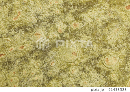 Mexican spinach flavored wheat tortilla wraps texture background Mexican spinach flavored wheat tortilla wraps texture background 91433523