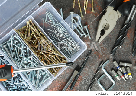Work tools on dark textured background, top view 91443914