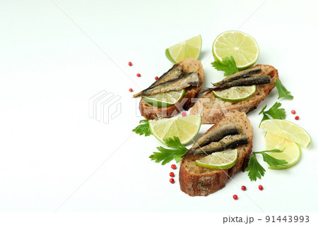 Delicious sandwiches with sprats on white background Delicious sandwiches with sprats on white background 91443993