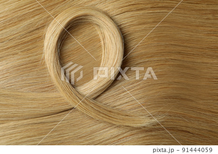 Light female hair on whole background, close up Light female hair on whole background, close up 91444059