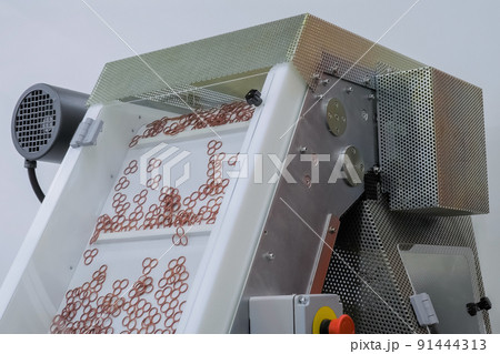 Plastic details moving on conveyor belt at exhibition, factory 91444313