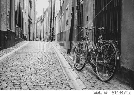 Vintage bike in old cobbled street of Stockholm Vintage bike in old cobbled street of Stockholm 91444717