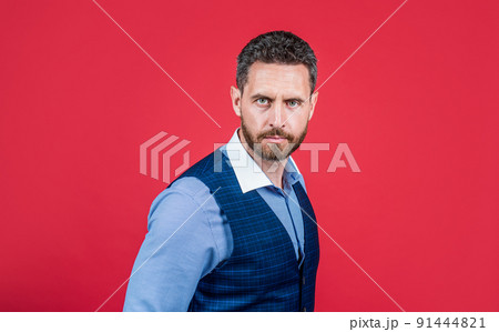 Bearded man with unshaven face and stylish haircut red background, hair 91444821