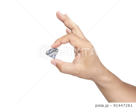 Hand holding diamond isolated on white background. concept for choosing best diamond gem Hand holding diamond isolated on white background. concept for choosing best diamond gem 91447261
