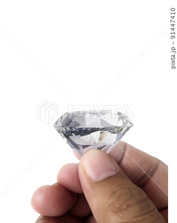 Diamond jewel in hand, isolated on white background Diamond jewel in hand, isolated on white background 91447410