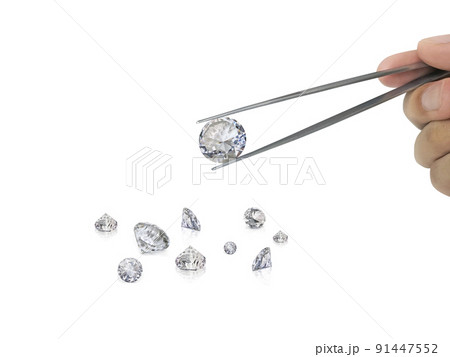 Selected diamonds In the gemstone clamp for making jewelry on white background Selected diamonds In the gemstone clamp for making jewelry on white background 91447552