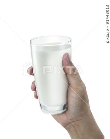 hand with glass of milk on a white background 91448013