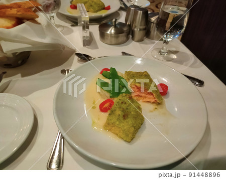 The fish at dinner at the abstract cruise ship restaurant 91448896