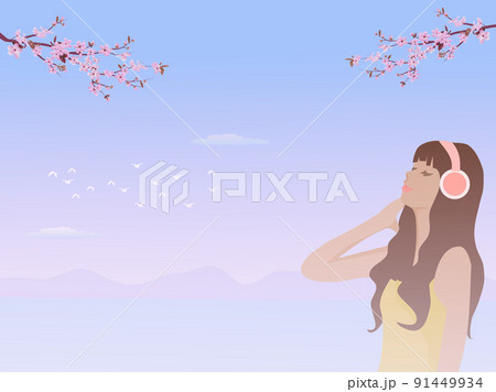 woman wearing headphones standing by the sea with cherry blossoms in the background woman wearing headphones standing by the sea with cherry blossoms in the background 91449934
