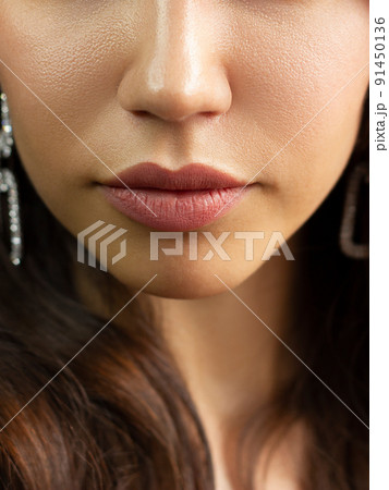 Cosmetics, makeup and trends. Bright lip gloss and lipstick on lips. Closeup of beautiful female mouth with natural lip makeup. Beautiful part of female face. Perfect clean skin Cosmetics, makeup and trends. Bright lip gloss and lipstick on lips. Closeup of beautiful female mouth with natural lip makeup. Beautiful part of female face. Perfect clean skin 91450136
