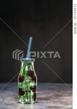 Fruit infuser water bottle with straw and fruits in water Fruit infuser water bottle with straw and fruits in water 91450572