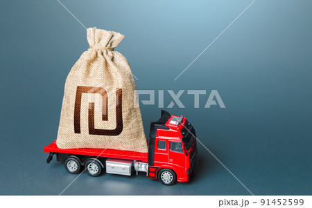 Truck with a israeli shekel money bag. Financial aid, investments and subsidies. Compensation. High super income. Payment of taxes. Debt load. Money transfers and transactions. Loan or deposit. 91452599