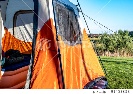 Assembled camping tent with anchor string and open flap Assembled camping tent with anchor string and open flap 91453338