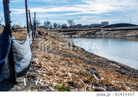 silt fence at a construction site with exposed dirt piled against the fabric silt fence at a construction site with exposed dirt piled against the fabric 91453457