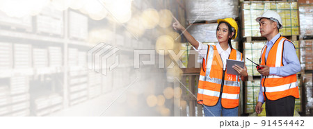 worker in warehouse,  using bar code scanner to scanning box and analyze newly arrived goods.  Working at warehouse.International export business concept 91454442