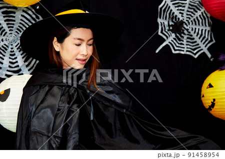 Asian young witch Halloween woman portrait. Sorcerer makeup with Fashion Asian young witch Halloween woman portrait. Sorcerer makeup with Fashion 91458954