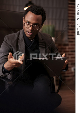 African american psychologist talking to partners at couple therapy, attending counseling session to solve issues. Explaining psychoanalysis and giving professional relationship advice. African american psychologist talking to partners at couple therapy, attending counseling session to solve issues. Explaining psychoanalysis and giving professional relationship advice. 91465175