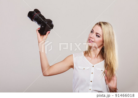 Beautiful woman with camera. Beautiful woman with camera. 91466018