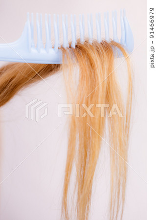 Blonde woman with her damaged dry hair. Blonde woman with her damaged dry hair. 91466979