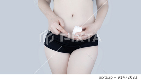 Irritation of the skin of the bikini area. consequences of depilation. Skin injuries. Pimples and redness after shaving. Panty area care concept. Sugaring and waxing. Cream against acne and redness 91472033