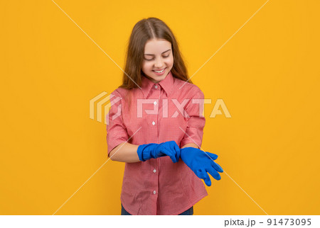 happy child wearing rubber gloves on yellow background 91473095