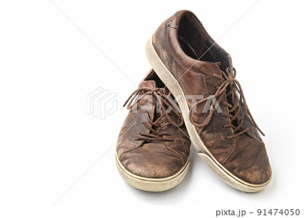 Beautifully aged vintage brown leather boots isolated on white background. Front view 91474050