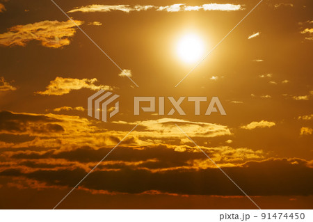 beautiful sunset sky, bright sunlight and dark silhouette of clouds as background 91474450