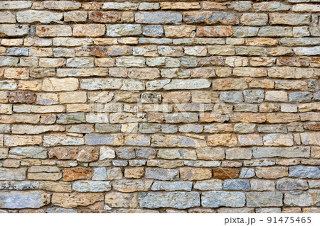 Slate, stone and brick wall texture background of the building or fence Slate, stone and brick wall texture background of the building or fence 91475465